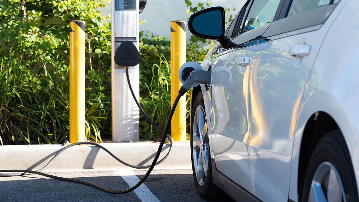 Charging an electric car at a parking lot